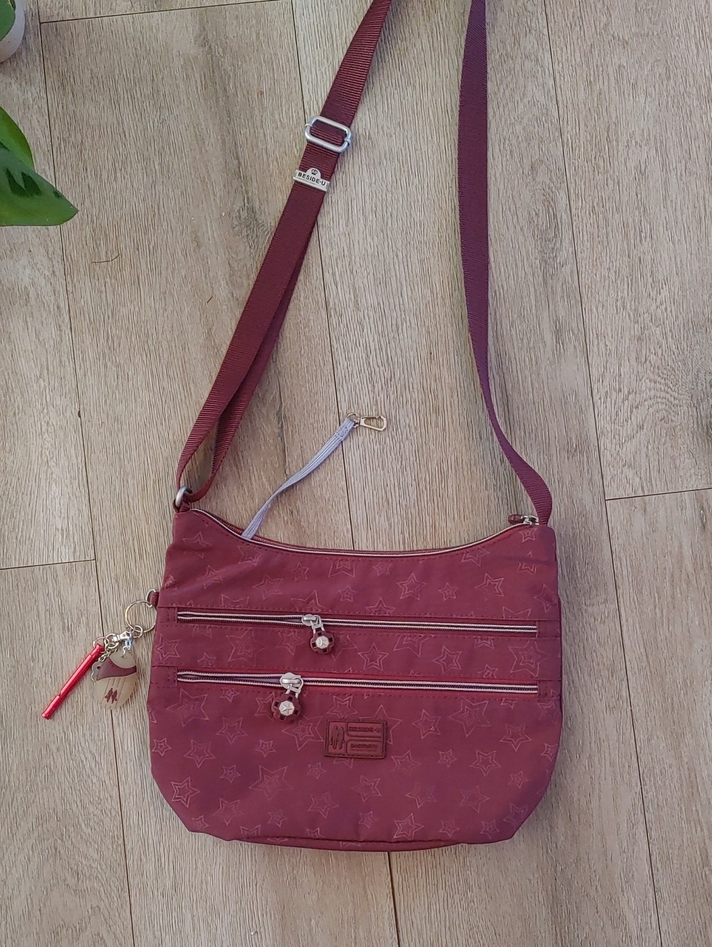 Star-Embossed Maroon Crossbody Bag with Adjustable Strap